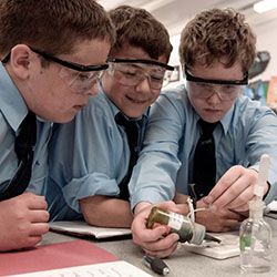 School children in a science class carrying out an experiment
